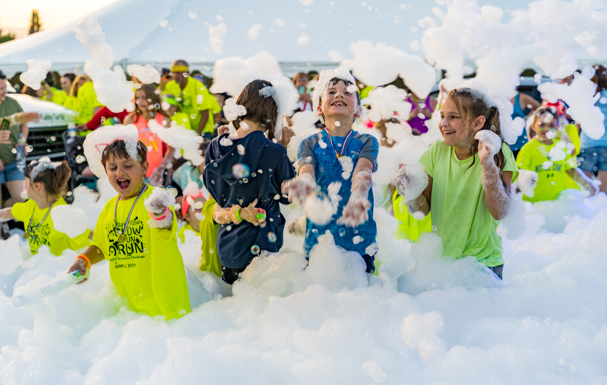 Kids running through foam at a party - Foam Dawgs foam party rentals Calhoun, GA